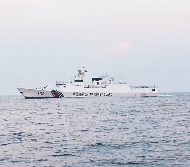 China Coast Guard vessel with bow number 4108 came as near as 100 meters to the mother boat of the Scarborough Shoal civilian convoy. INQUIRER.net/John Eric Mendoza
