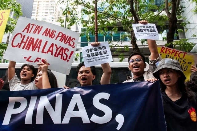 PROTEST. Activists gather at the Chinese Consulate in Makati City to protest China's actions during an encounter in the disputed waters of the West Philippine Sea, on April 9, 2024.