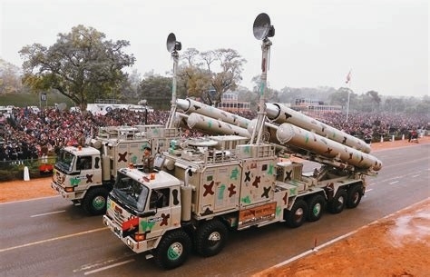 The Brahmos transporter trucks parading, each carrying an array of Brahmos missiles.