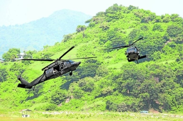 AIR SHOW | Air Force choppers in aerial maneuvers at the Crow Valley Gunnery Range (Col. Ernesto Ravina Air Base) in Capas, Tarlac, on Monday, July 3, 2023. (Photo by NIÑO JESUS ORBETA / Philippine Daily Inquirer)