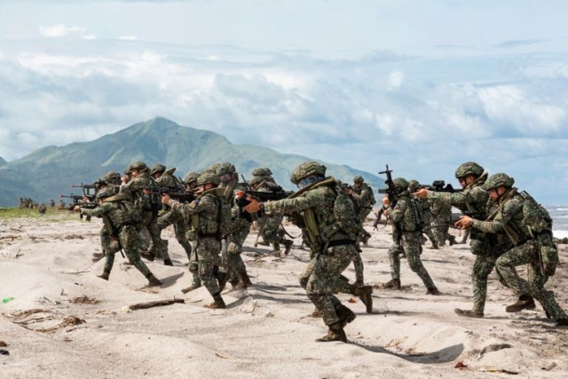 Philippine soldiers take part in a large-scale combined amphibious assault exercise on August 25, 2023, at a naval base in San Antonio, Zambales, Philippines [Riley Blennerhassett/Australian Department of Defence via AP Photo]