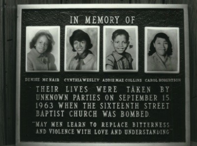 Memorial black for the 4 girls killed in the Birmingham church bombing, with their photographs, names and the words: Their lives were taken by unknown parties on September 15, 1963 when the Sixteenth Street Baptist Church was bombed. May men learn to replace bitterness and violence with love and understanding.