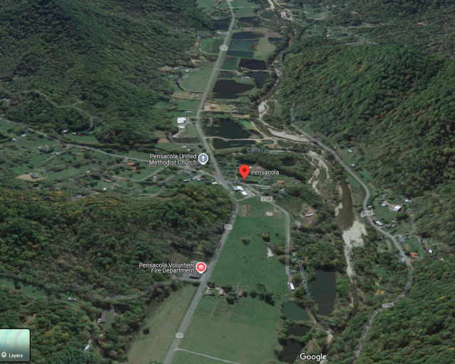 Satellite view of a community at the intersection of two river valleys. It consists of a couple churches, a small general store, and scattered homes. Swampy ponds like the Cane River, and Cattail Creek feeds into it.