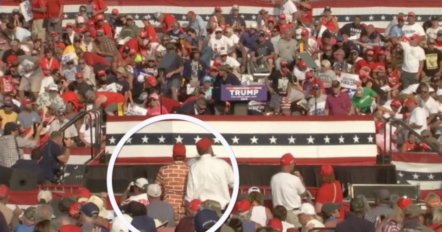 Pseudo-celeb "Wall Suit Guy" from 2020 was at the Butler rally in 2024.

Two people above him in the black jacket you can see "fake-JFK Jr" in the bleachers behind Trump. This is a reminder that most of Trump's crowds consists of "Groupies" who follow him from town-to-town.