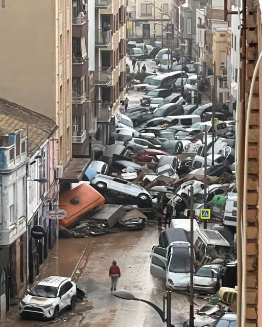 A mass of cars piled on top of each other in a narrow street in Sedavi, Valencia, Spain from Wednesday October 30, 2024.