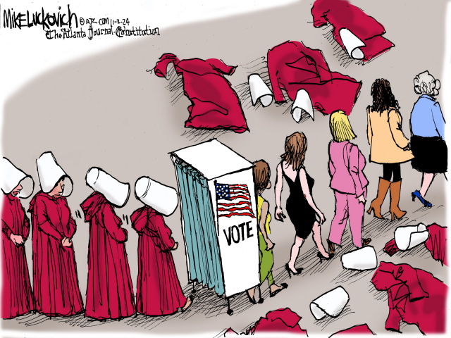 Cartoon: 
A line of women dressed in the Handmaid’s Tale costume (red cloaks, white bonnets) approach a voting booth. Emerging from the other side of the booth the line continues but now the women are wearing normal clothes, the cloaks and bonnets discarded on the ground. 