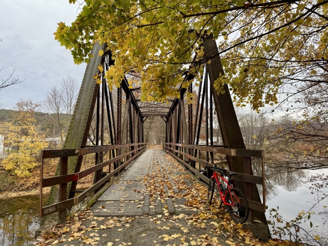 Old railroad bridge across the river, big steel beams