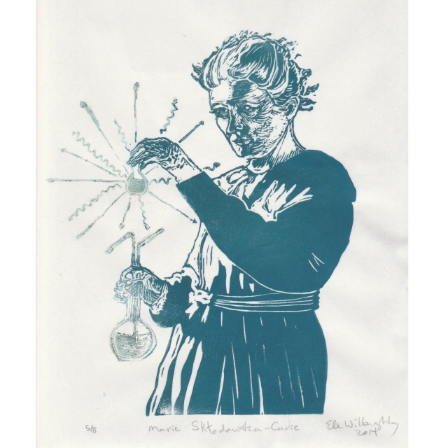 My linocut print of Marie Curie in teal, holding glassware with radiating straight arrows and wiggly lines (to represent particles and photons respectively) in glow in the dark ink