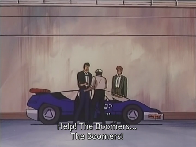 Leon and Daley from Bubblegum Crash in front of a car. A terrified worker runs to them screaming: "Help! The boomers. The boomers!"