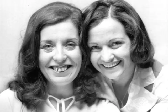 Mairead Corrigan and Betty Williams side by side. They are both white women with dark hair.