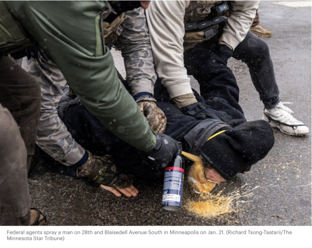 Federal agents appear to be pepper spraying a protester in the face WHILE three agents are holding him down on the ground.