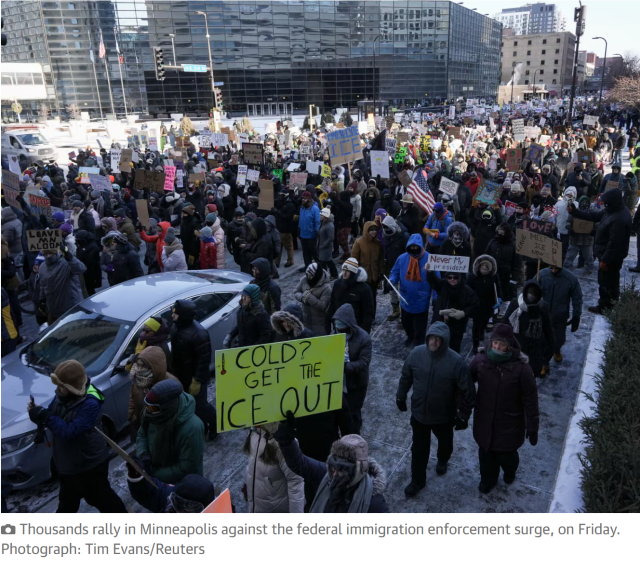 Photo with caption.

Photo: A huge mass of protestors march down the street holding anti-ICE signs.

Caption: Thousands rally in Minneapolis against the federal immigration enforcement surge, on Friday. Photograph: Tim Evans/Reuters