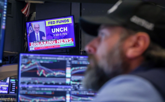 S&P 500 briefly surpasses 7,000, then closes little changed as Fed keeps rates steady: Live updates