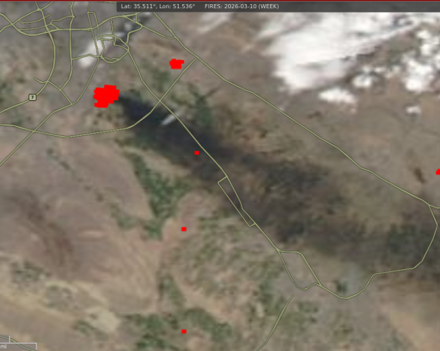 Satellite image, showing red fire detections and massive cloud of black smoke